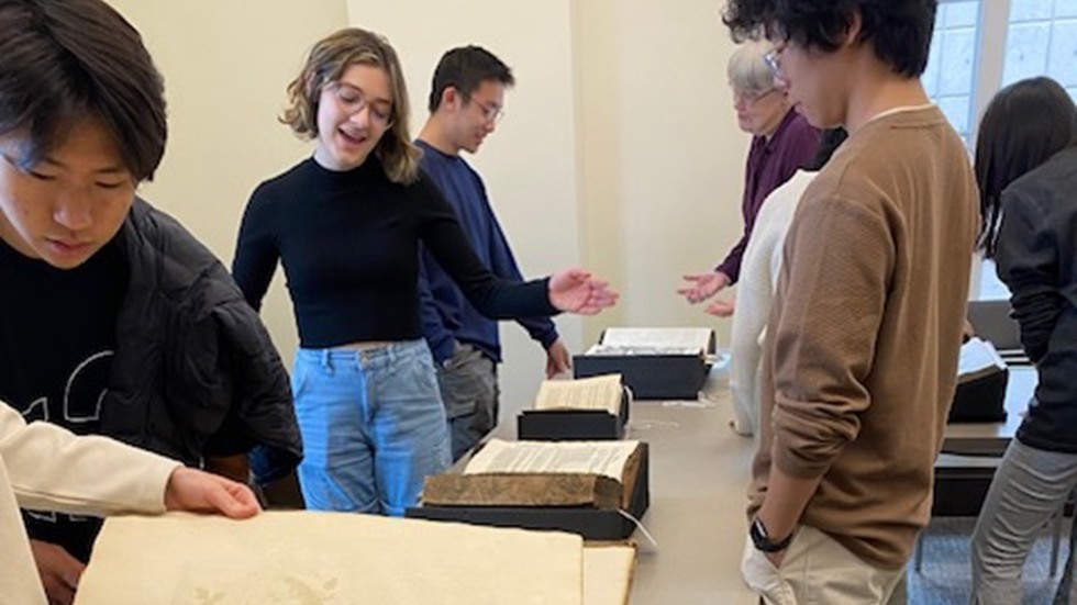 Students looking at rare books
